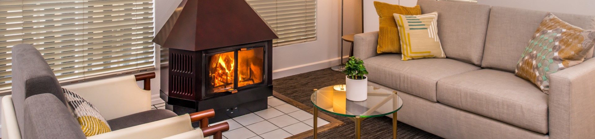 Living room area with sofa and fireplace