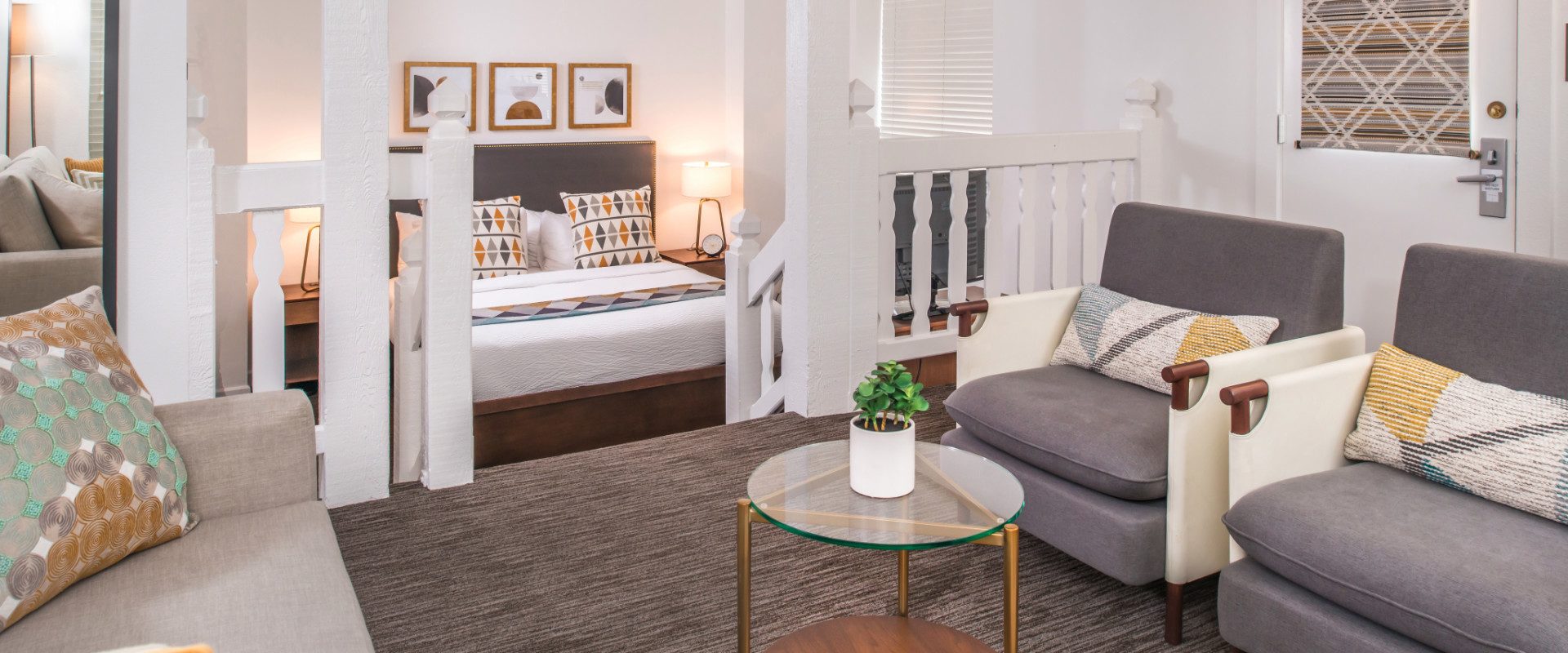 Bedroom with bed and two chairs